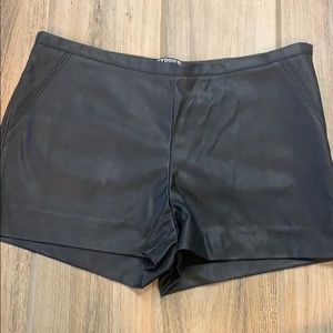 Black faux leather shorts